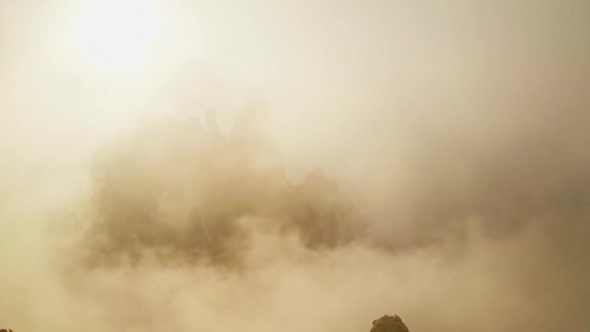 Heavy clouds cover the mountain top