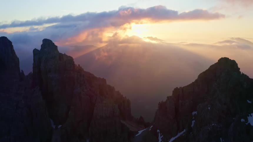 Aerial view of mountains at dusk is displayed