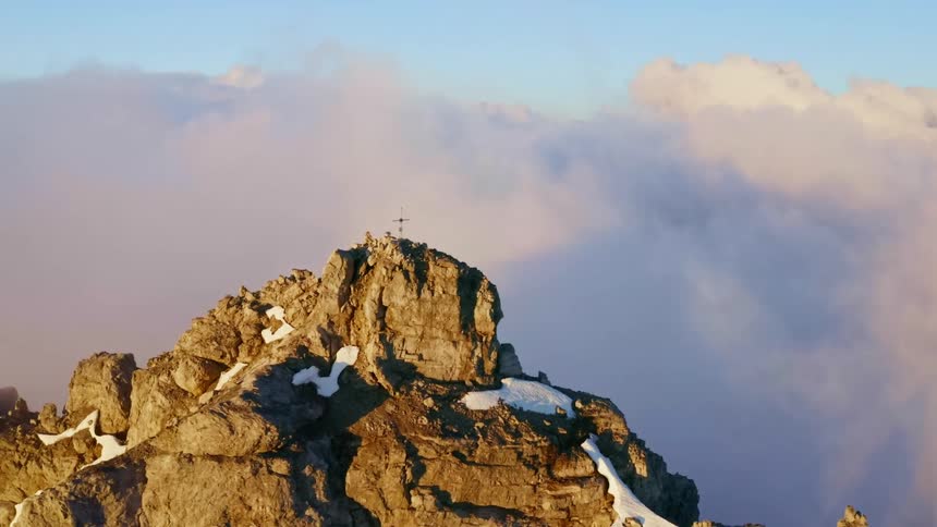 Snow is covering the mountains at dusk