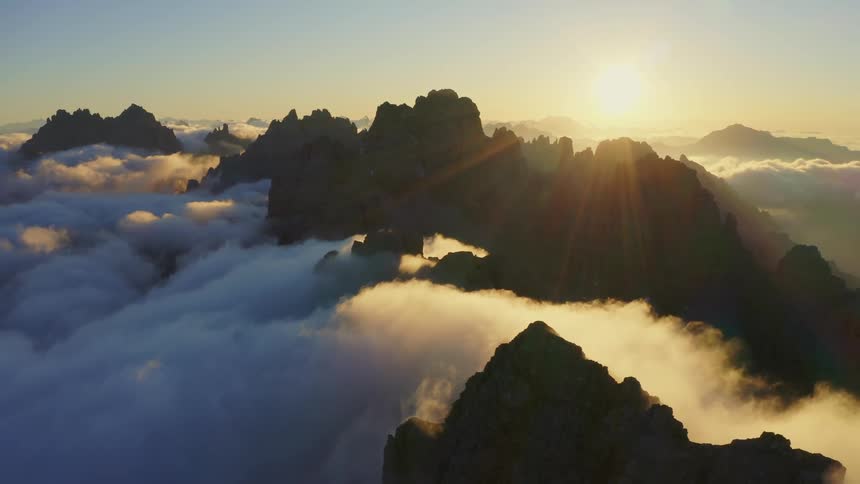 Aerial view of mountains at dusk is displayed