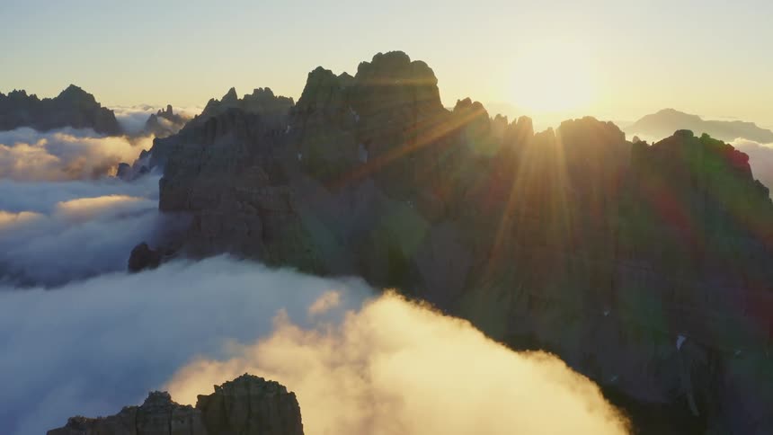 Aerial view of mountains are displayed when the sun is setting