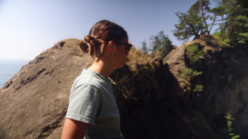 A woman is hiking outdoors in spring
