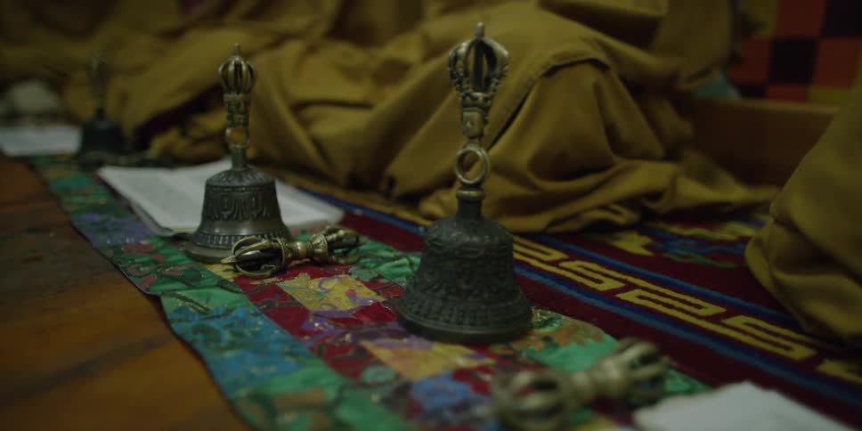 A set of bells sits on the floor