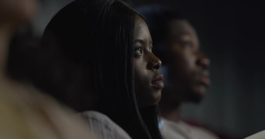 Man and woman watch a movie in the movie theater