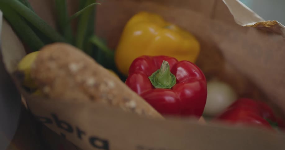 A person is unpacking groceries