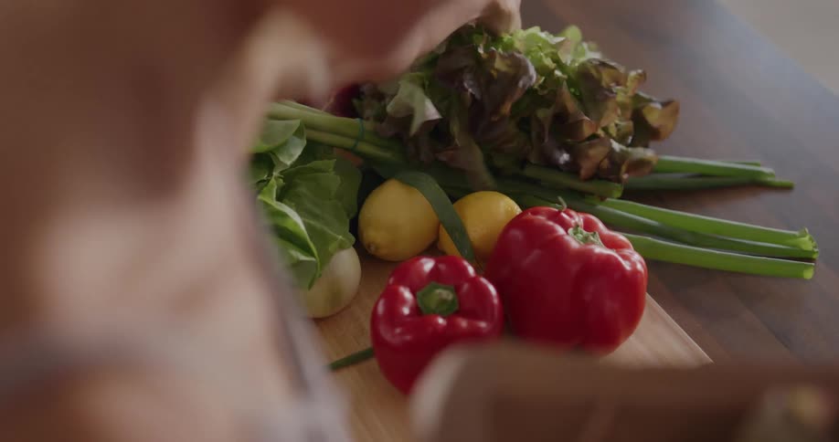 A woman unpacking groceries at home