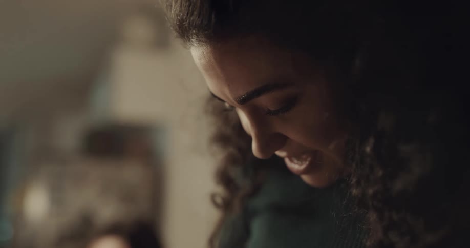 A young woman talking indoors