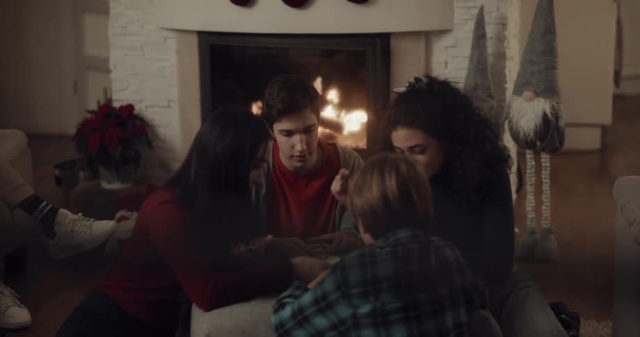 A group of people playing a game in a house