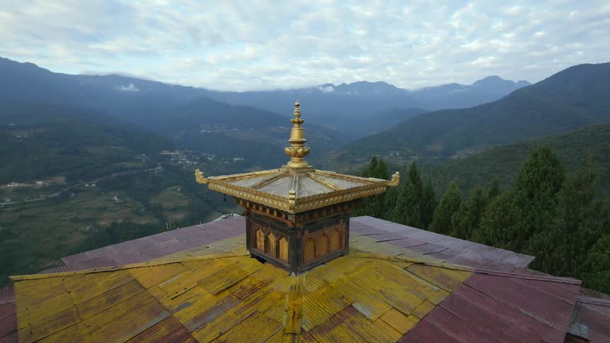 The top of a temple building looking out across a vast valley