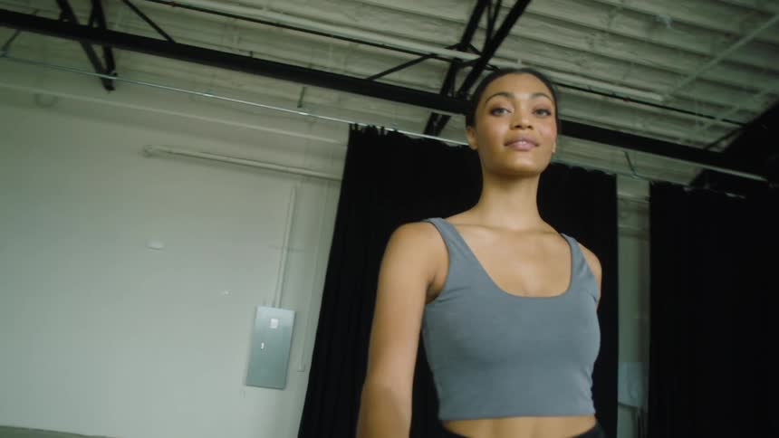 Woman prancing around for a photoshoot