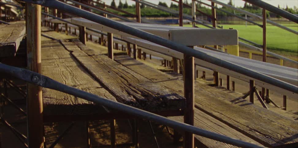 Old weathered wooden bleachers in a stadium