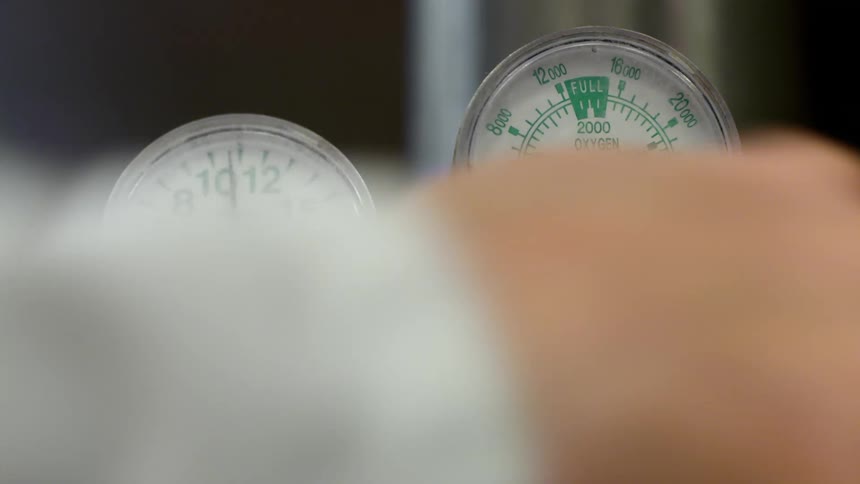 Person turns knob resulting in gauge readout changing