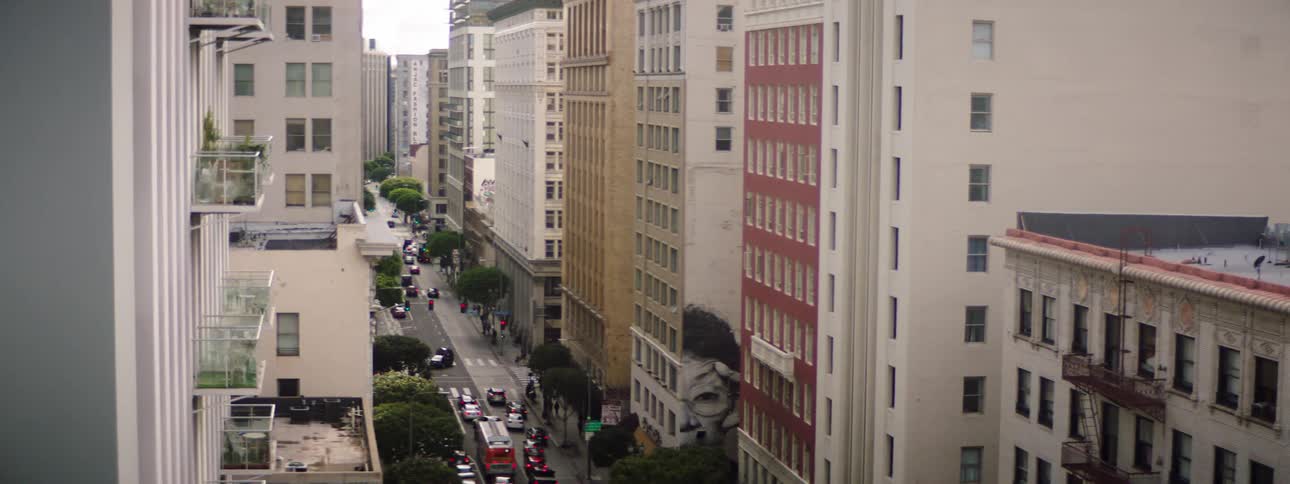 Vehicles are in traffic on the city street