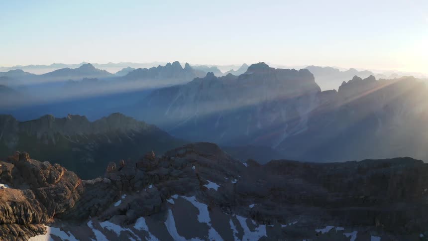 Aerial view of mountains at dusk is displayed