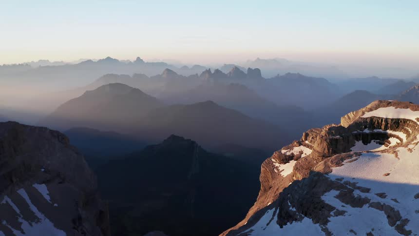 Aerial view of mountains in winter is displayed