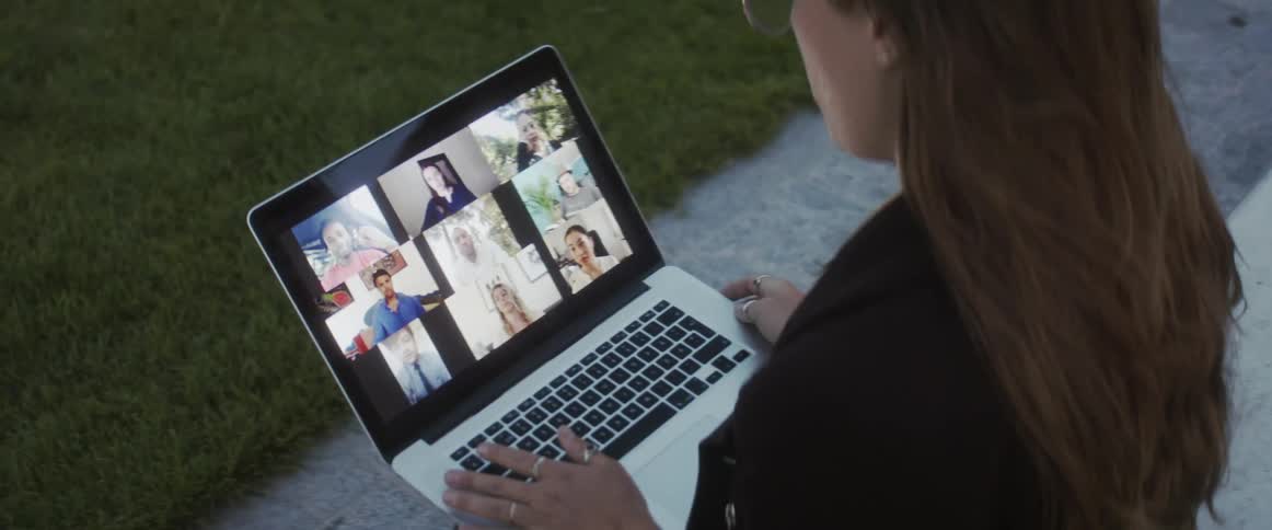 Woman talking to people on a video call on her laptop