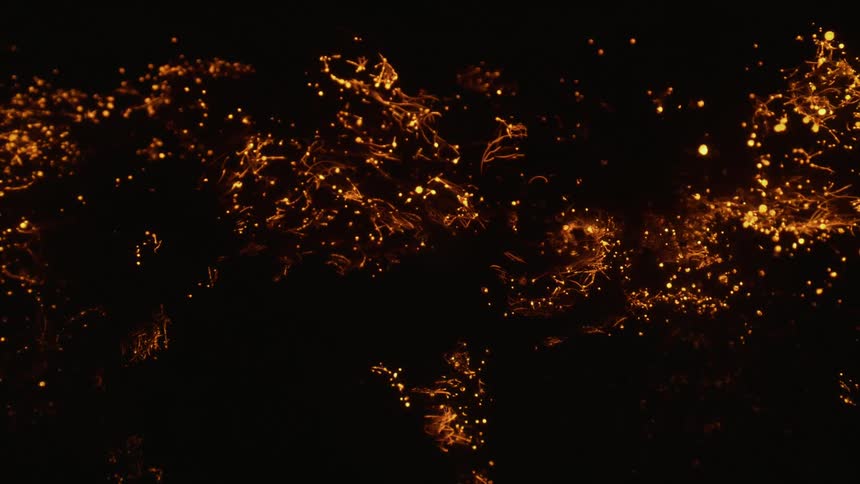 Ember glowing lights flicker scattering about back and forth between each other in dark enclosed area