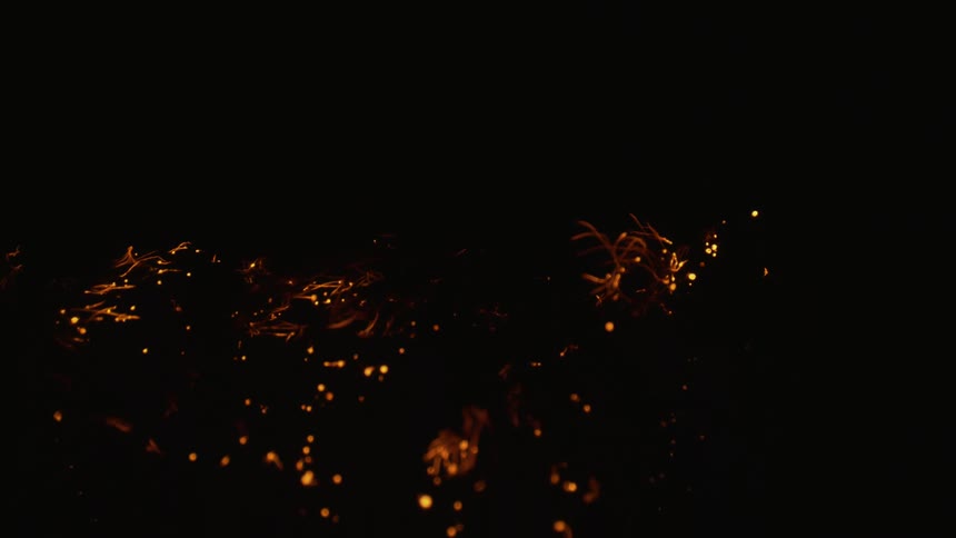 Black orange and yellow colors that look like embers burning in the dark