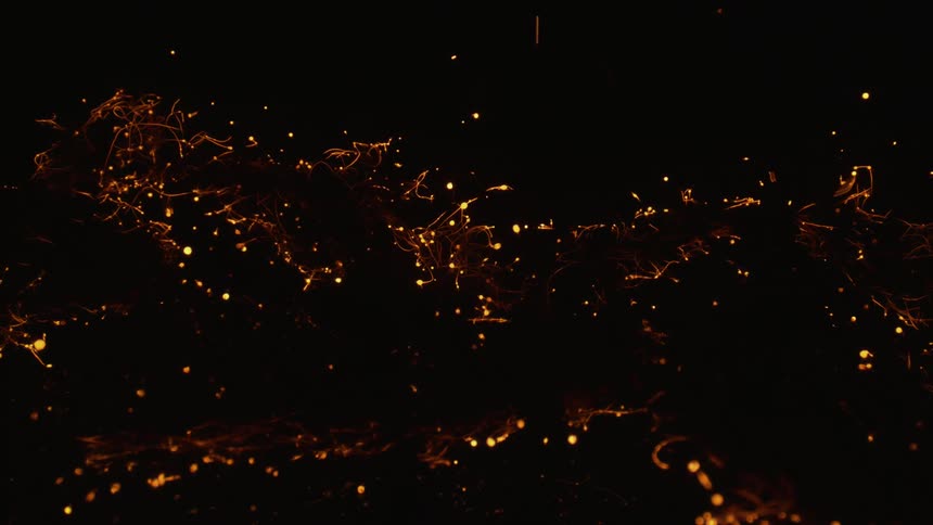 A close up of burning embers in the dark