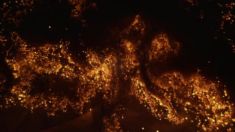 Fibers and particles form glow and move against black background
