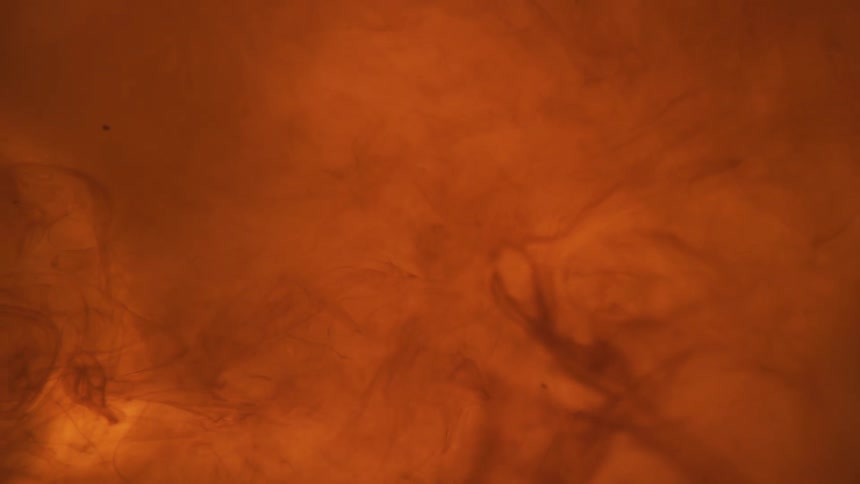 Swirling orange and yellow liquid