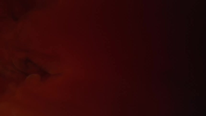 The red clouds move around in the dark