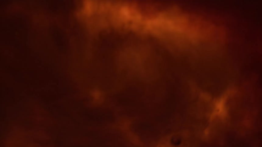 Whirling red ink liquid bubbles water light ripples