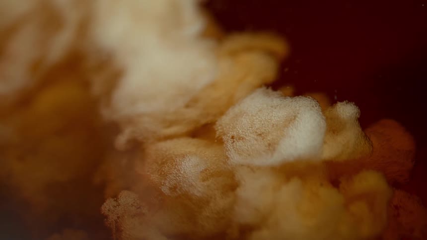 Bubbling and foaming orange liquid