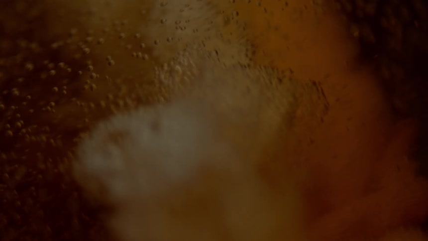 Brown liquid with bubbles