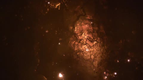 Sparks fly and explode in a liquid to create a fire effect