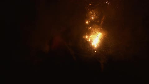 Brown white and gray colors that look like fire burning underwater with smoke and bubbles