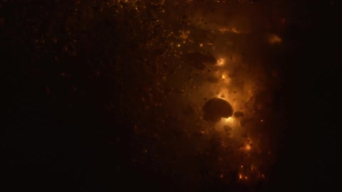 Sparks from a flare or firework bubbling underwater