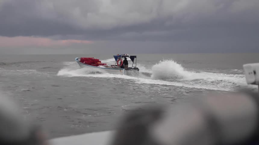 Boats driving away from the shore