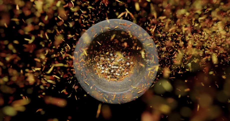 Spices are dropped into a mortar
