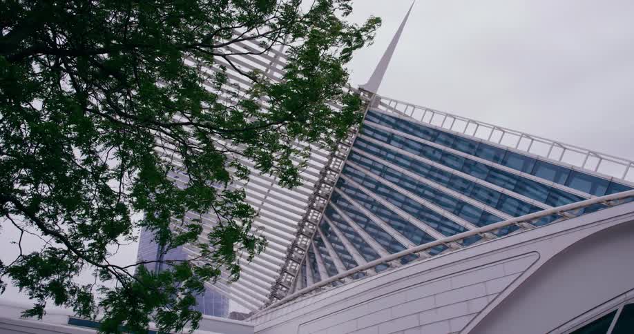 A bottom up shot of a modern building in a city