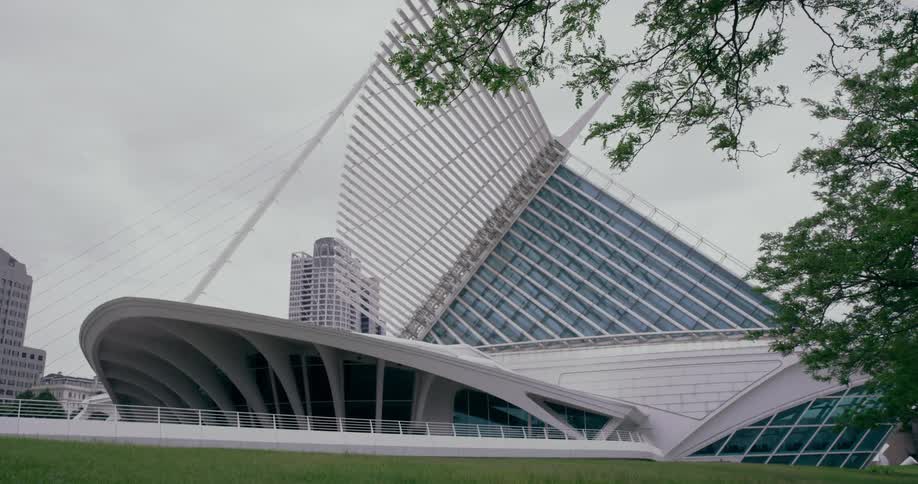Large white architectural structure located in a city