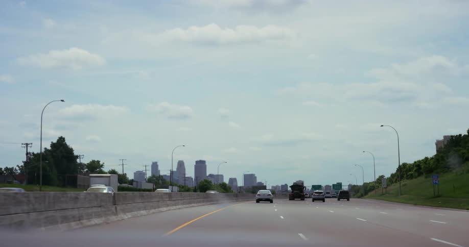 Vehicles driving down a city street