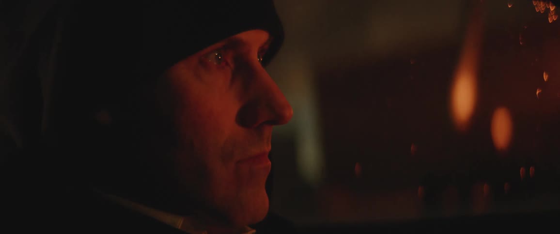 A person is driving a car at night