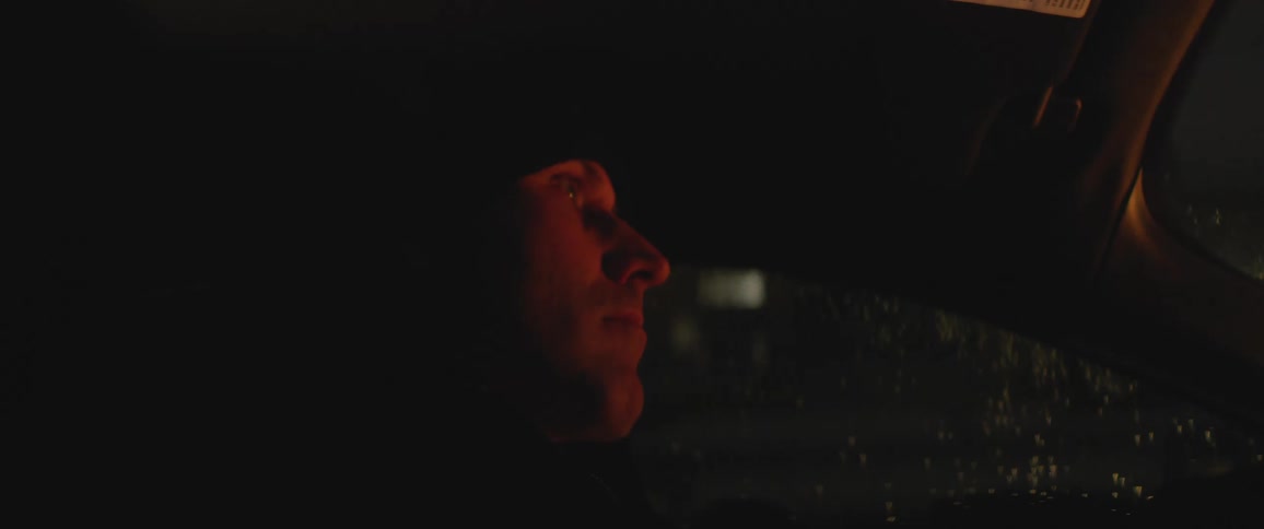 Man driving his car looking around