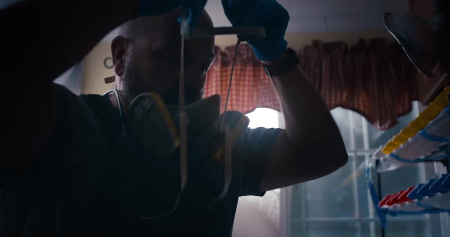 A doctor putting a mask on