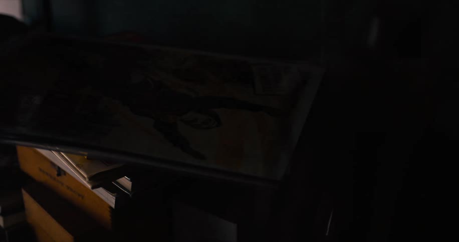 Comic sitting on top of a drawer in a dark room