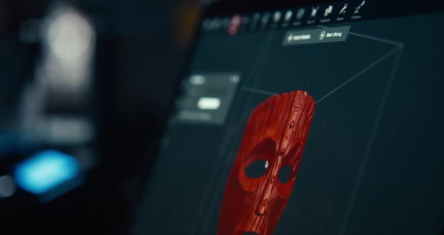 Computer screen with 3d red face zoomed in and out