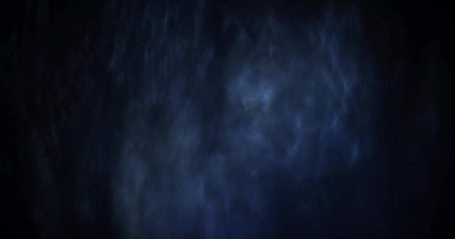 White gray and blue colors that look like water falling with light