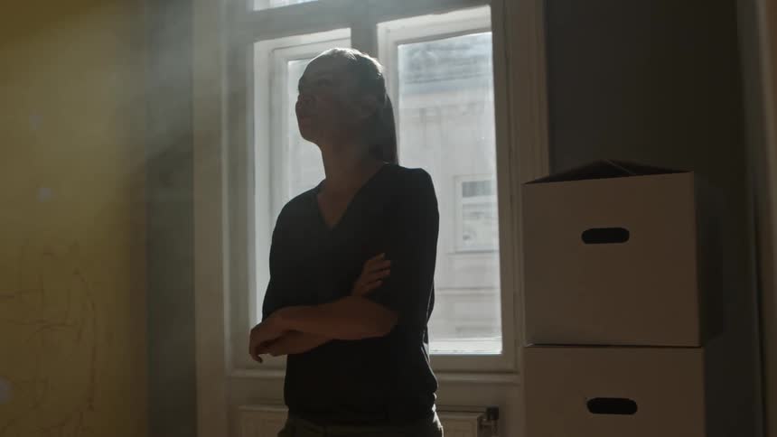 Woman thinking about the room she is in
