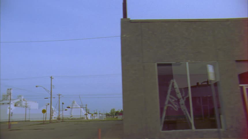 The buildings of a block in a small city during the day
