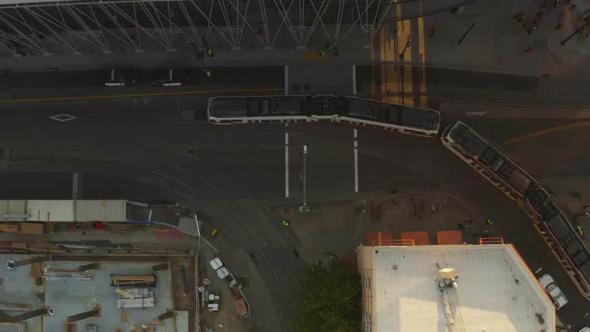 A long bus turns the corner