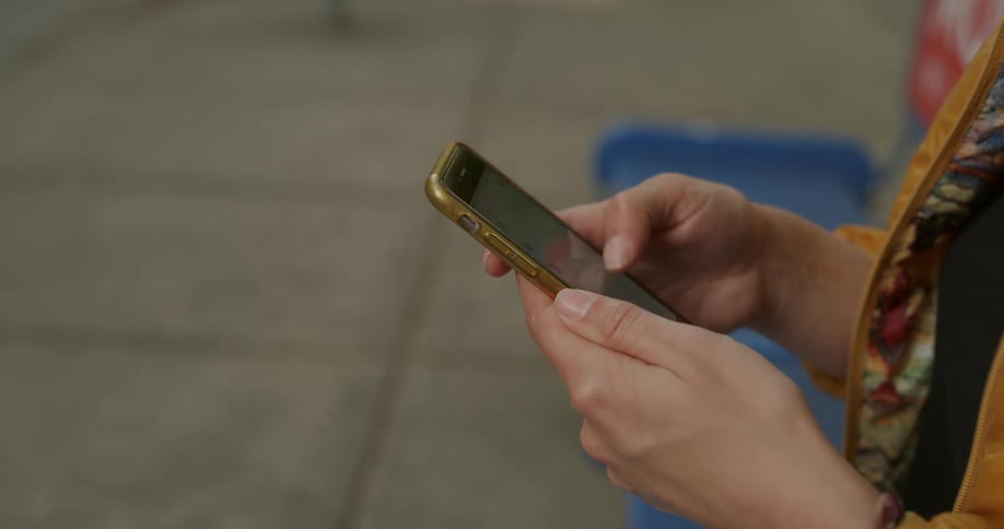 Woman scrolling through her phone and clicking on something