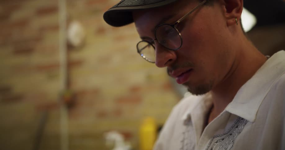 A man sits quietly reading a book
