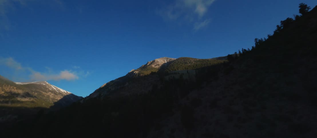 Snow topped mountains in nature in the daytime