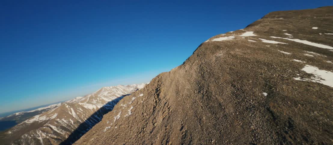 Aerial view of mountains in winter is displayed